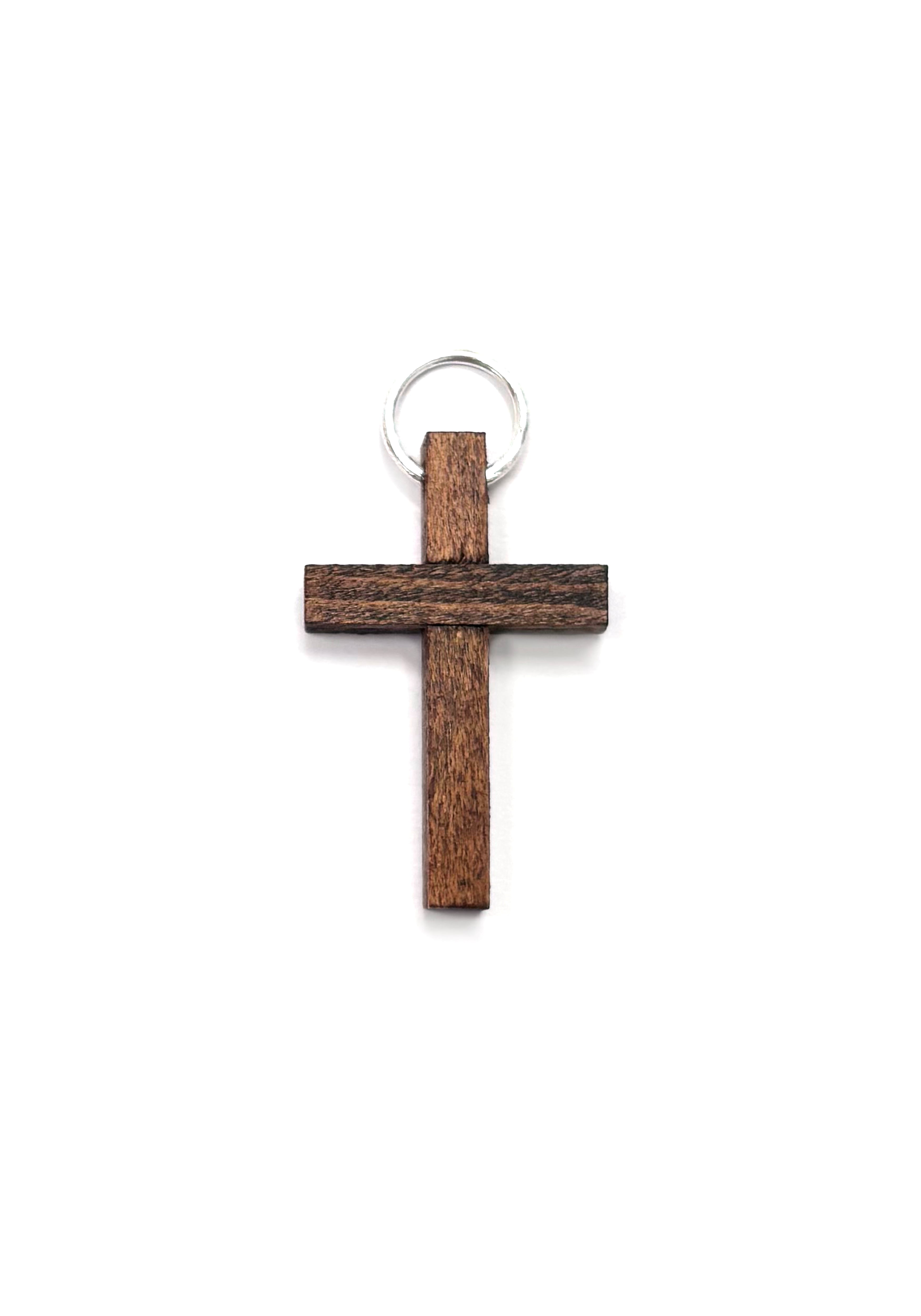 Pequeña cruz rústica de madera marrón