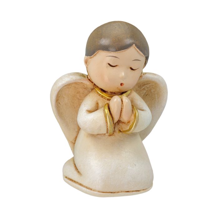 Ángel de Navidad arrodillado rezando