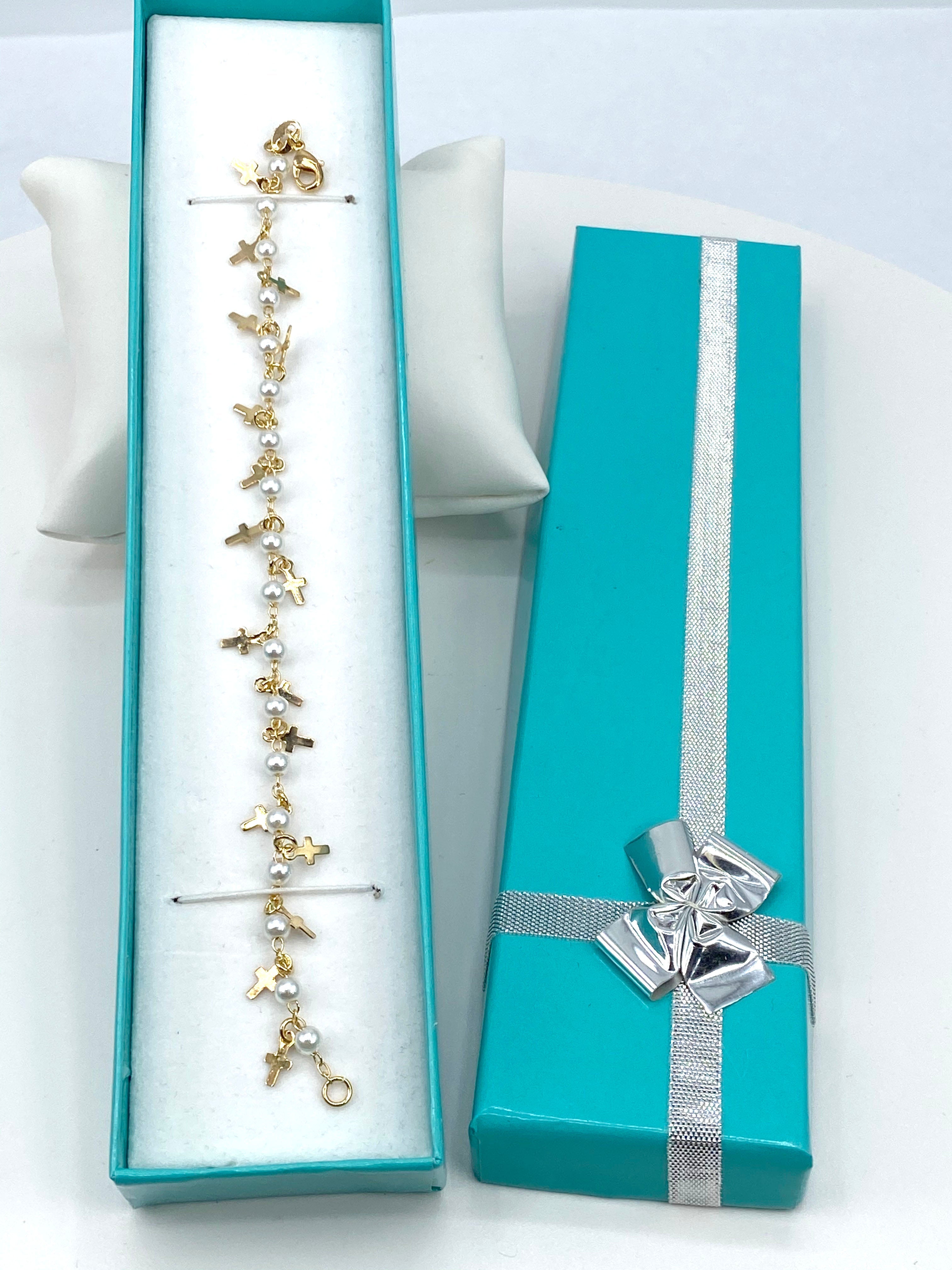 Bracelet  with simulated pearls and  crosses charms