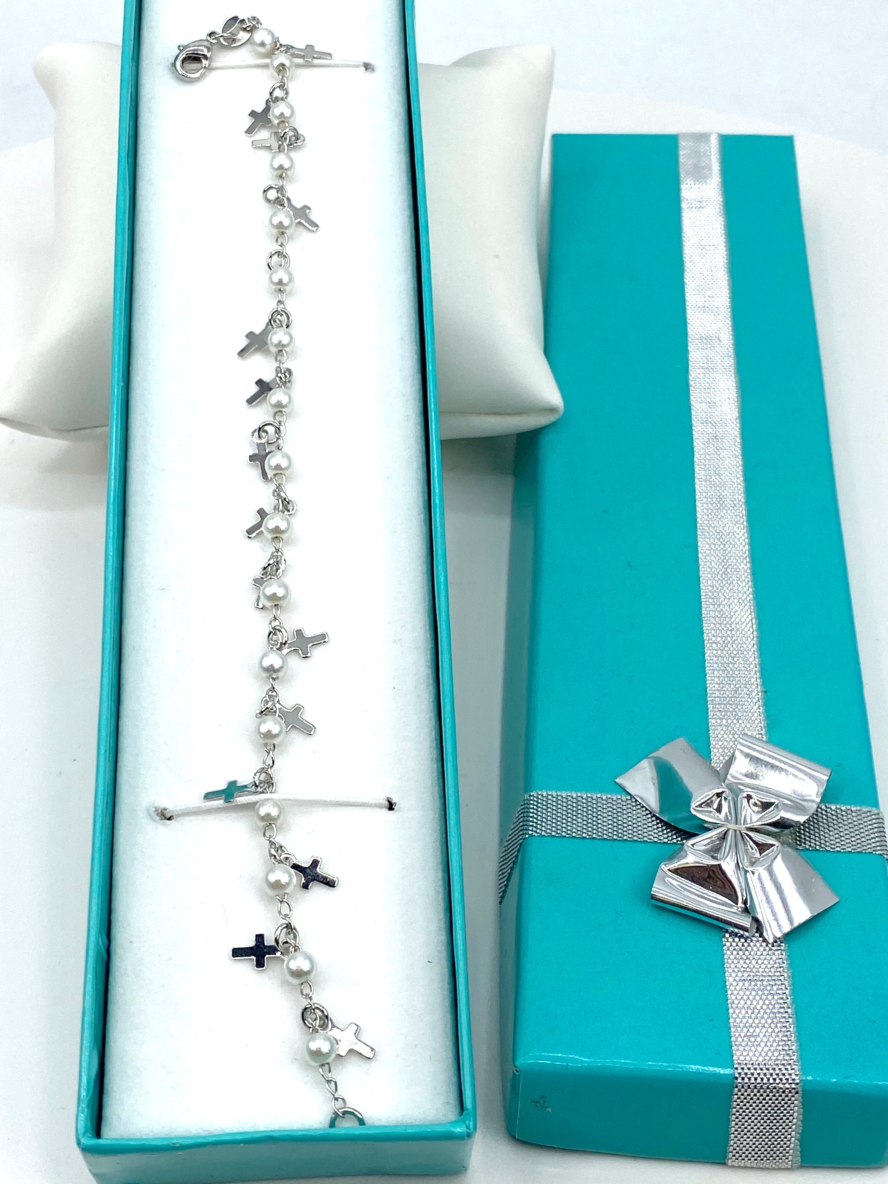 Bracelet  with simulated pearls and  crosses charms