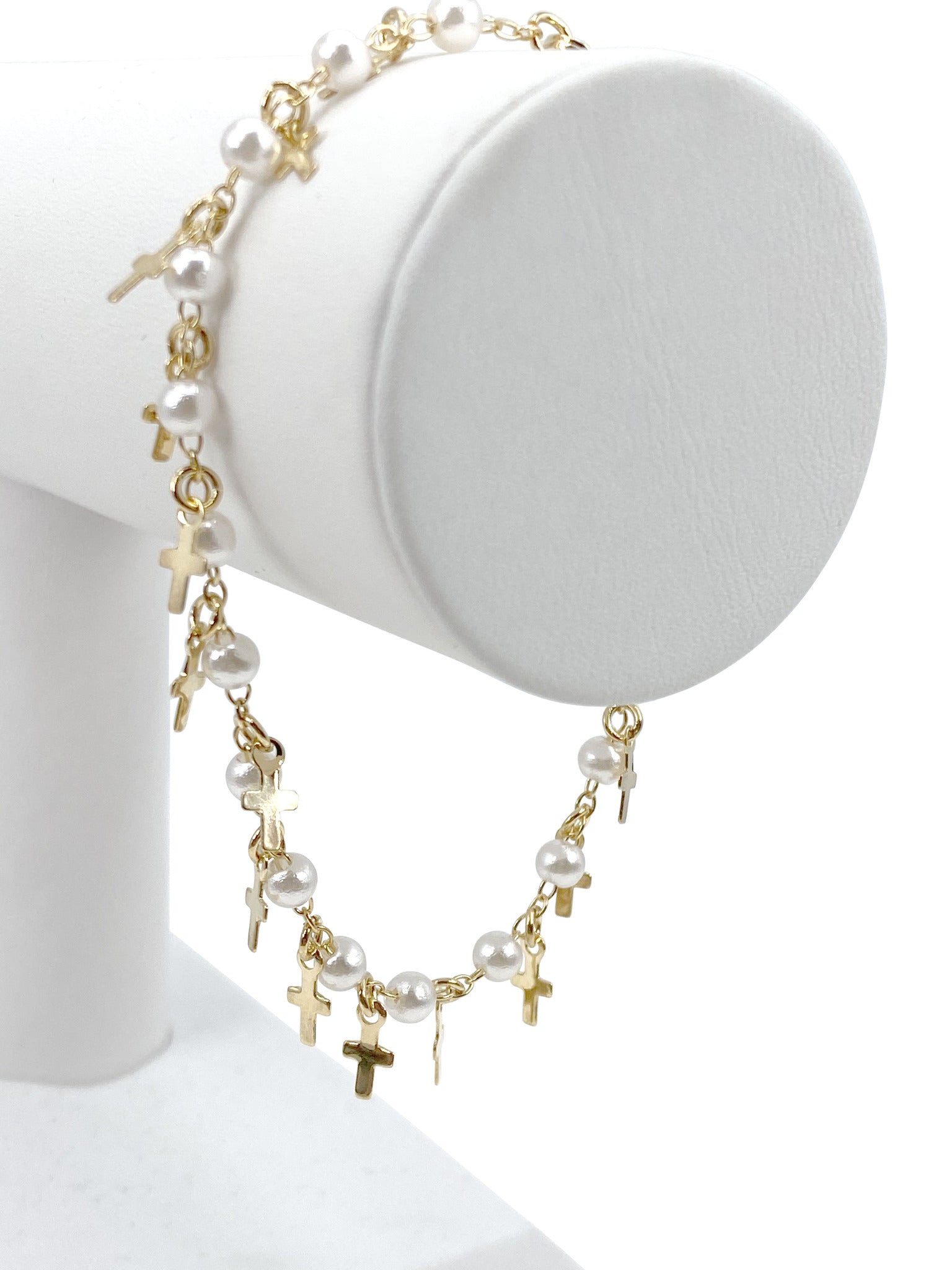 Bracelet  with simulated pearls and  crosses charms