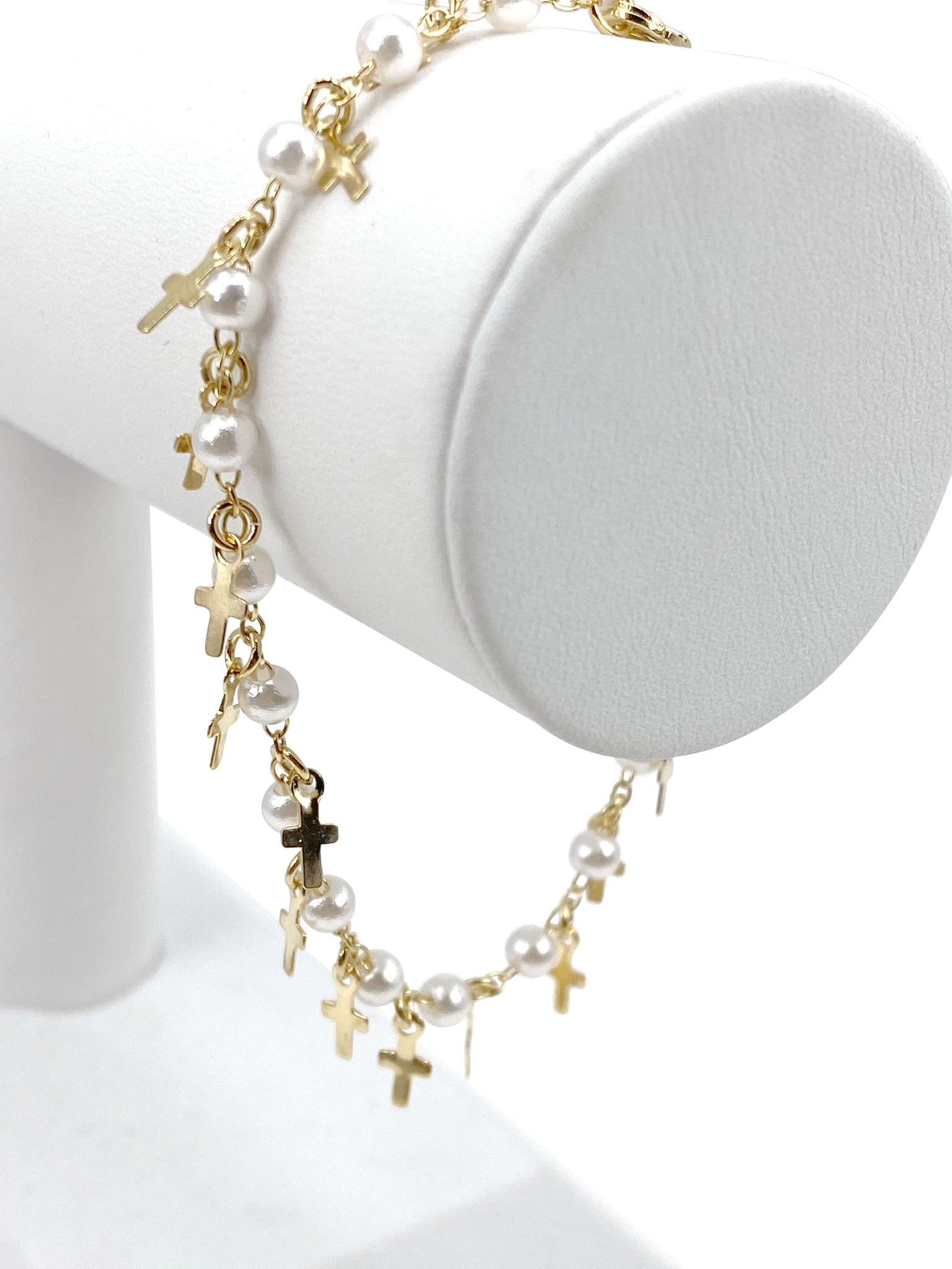 Bracelet  with simulated pearls and  crosses charms