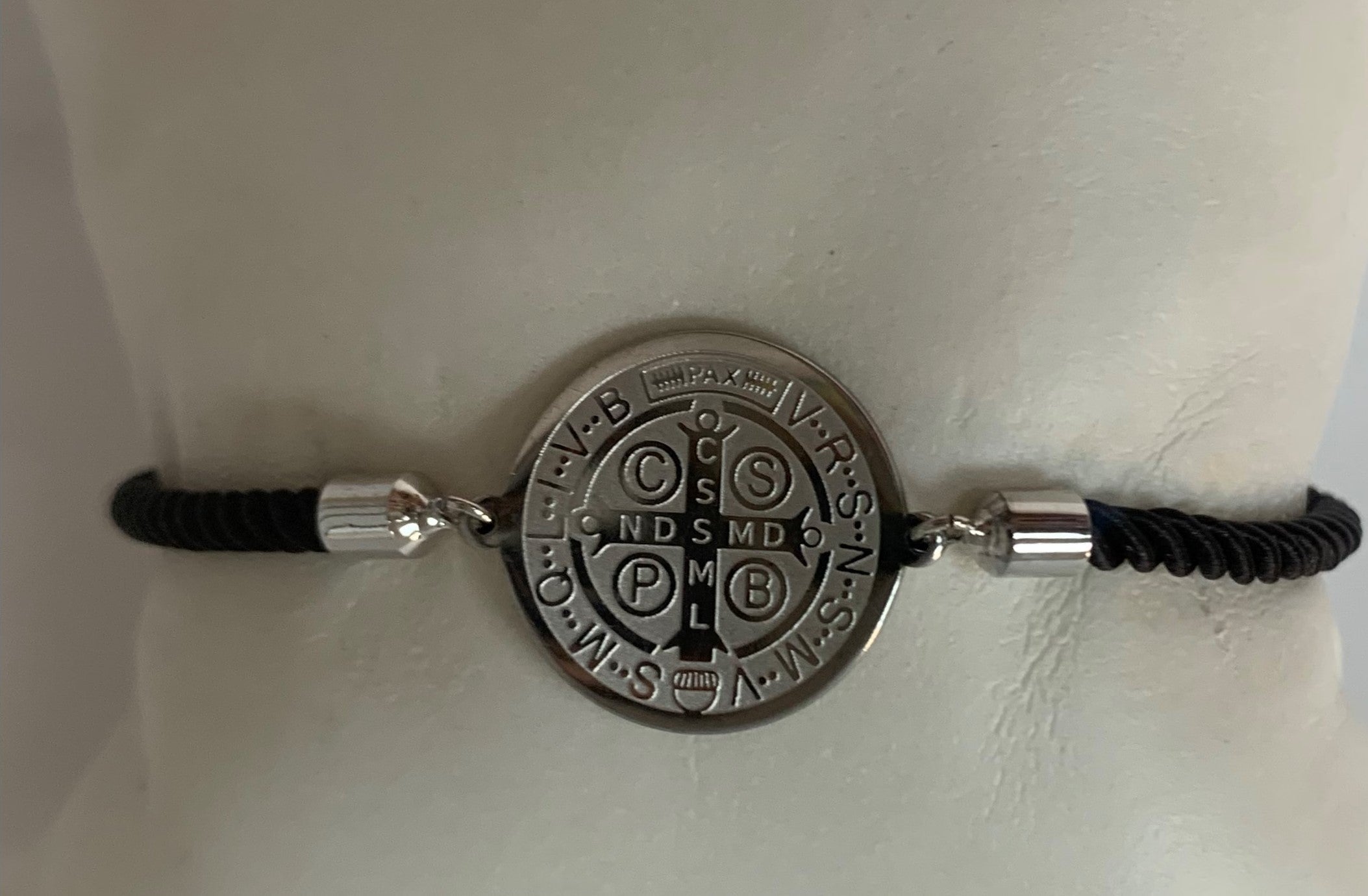 Cord bracelet with St Benedict medal